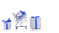 Xmas delivery. Trolley cart for supermarket with christmas or birthday gift box isolated on white background. Online valentine,