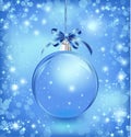 Xmas glass blue ball with snow inside and bow.