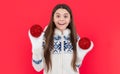 xmas holiday. surprised teen girl with red xmas decoration in studio. teen xmas girl Royalty Free Stock Photo