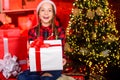 Xmas mood. family holiday. kid in shopping mall. happy new year. child in red santa hat. kid with present box. winter Royalty Free Stock Photo