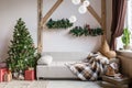 Xmas in morning living room. Sofa bed In christmas Interior. celebrate the new year and holidays. Christmas tree and Royalty Free Stock Photo