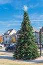 Xmas tree with snowflake and colorful glass ornaments balls at daytime in Coppell, Texas