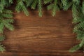 Xmas wooden background with green pine branches.