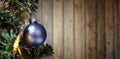 Xmass ball ornement tree against textured wooden wall Royalty Free Stock Photo