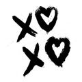 XOXO hand written phrase with hearts isolated on white background with ink spray. Hugs and kisses sign. Grunge brush lettering XO