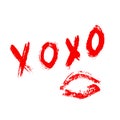 XOXO hand written phrase and red lipstick kiss isolated on white background. Hugs and kisses sign. Grunge brush lettering XO. Easy Royalty Free Stock Photo