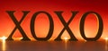 XOXO letters lighted on red background. Banner