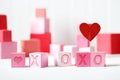 XOXO message with pink and red blocks