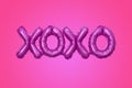 XOXO party balloon on pink Royalty Free Stock Photo