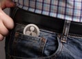 XRP coin in pocket jeans