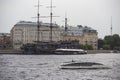 XVIII century Dutch wooden fluyt merchant sailing ship with three masts and a speed boat on Neva