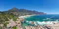 XXL aerial panoramic drone view of Camps Bay, an affluent suburb of Cape Town, South Africa.