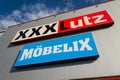 XXXLutz Mobelix corporation logo on supermarket building