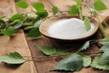 Xylit (birch sugar) on a wooden spoon Royalty Free Stock Photo