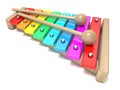 Xylophone with rainbow colored keys and with two wood drum stick Royalty Free Stock Photo