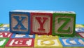 XYZ alphabet wood block on surface