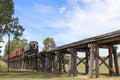 A Y class diesel locomotive hauls carriages across the Winters Flat trestle bridge on its way from Castlemaine to Maldon