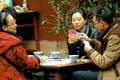 Yaan China-Four men is playing poker cards