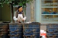 Yaan China-An old women picking up trash Royalty Free Stock Photo