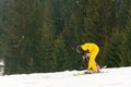 Yablunytsya, Ukraine February 2, 2019: woman in a yellow suit goes skiing, tourists of Ukraine in the village of Yablunytsya