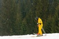 Yablunytsya, Ukraine February 2, 2019: woman in a yellow suit goes skiing, tourists of Ukraine in the village of Yablunytsya