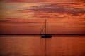 Yach on water. Boat on ocean at sunset. Sailboats with sails. Sea traveling. Royalty Free Stock Photo