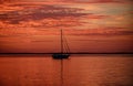 Yach on water. Boat on ocean at sunset. Sailboats with sails. Sea traveling. Royalty Free Stock Photo