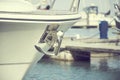 Yacht anchor close-up seen on the front of a luxury boat. Sailboat bow parked in harbor, yachting, sailing Royalty Free Stock Photo