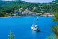Yacht at anchor in front of Agios Stefanos, Corfu, Greece Royalty Free Stock Photo