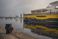 Yacht is at anchor and wooden jetty Royalty Free Stock Photo