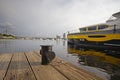 Yacht is at anchor and wooden jetty Royalty Free Stock Photo