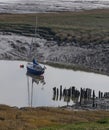 Yacht anchored on mudflats