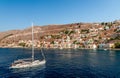 A yacht sailing in the gulf of Symi, Greece.