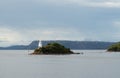 Yacht approaching the lighthouse in Macquarie Harbour Royalty Free Stock Photo