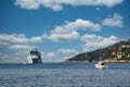 Yacht Approaching White Cruise Ship