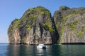 Yacht and beautiful limestone cliffs and clear sea of Phi Phi Le