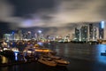 Yacht or boat next to Miami downtown. Beautiful colorful city of Miami Florida skyline and bay with night clouds. Royalty Free Stock Photo