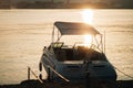 Yacht boat at the pier, the morning sun shines into the water Royalty Free Stock Photo