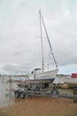 Yacht and boat trailer on foreshore