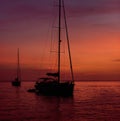 Yacht at Cala Saona in Formentera during the colorful sunset. Royalty Free Stock Photo