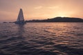 Yacht - Catamaran in the ocean. Sailing at sunset