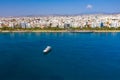 Yacht cruising near Limassol seafront, aerial view