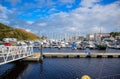 DOUGLAS, ISLE OF MAN - OCTOBER 17: Yacht docking at bay in a nice small port in a clear blue sky day in a small town of Doug