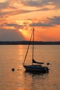 Yacht drifting on the lake during beautiful summer sunset Royalty Free Stock Photo