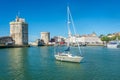 Old Port at La Rochelle, Charente Maritime, France with sailboat and ancient towers