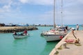 Yacht and fishing boat at port