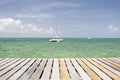 Yacht in front of wooden pier, Caye Caulker