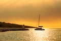 Yacht getting ready to be moored in the harbor of a small town called Postira - Croatia, island Brac Royalty Free Stock Photo