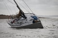 A yacht heeling due to being aground at the entrance to hamble river in the solent