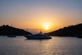 Yacht, luxury boat on calm sea at sunset in the Aegean sea, Greece, Kea island